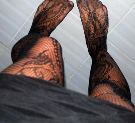 In black floral fishnets