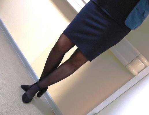 Co worker in pantyhose, skirt and heels