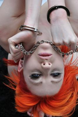 Pale redhead in bondage