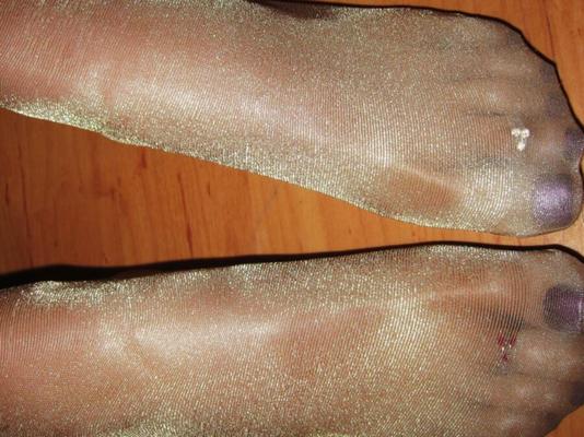 Wifes feet in shiny tan pantyhose