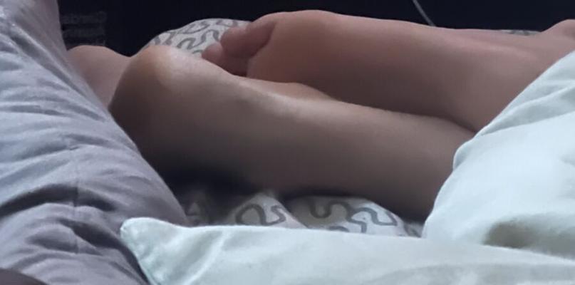 Sleeping teen boy feet smooth