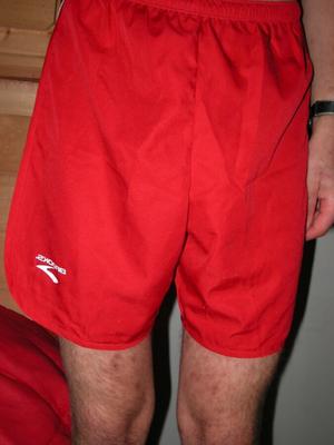 shorts de corrida Brooks vermelhos