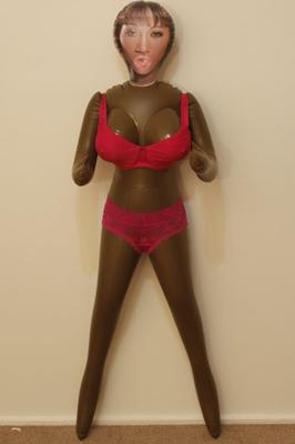 India Nubian doll wears a pink bra and panties