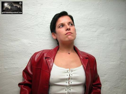 Short-haired girl spanked in leather jacket