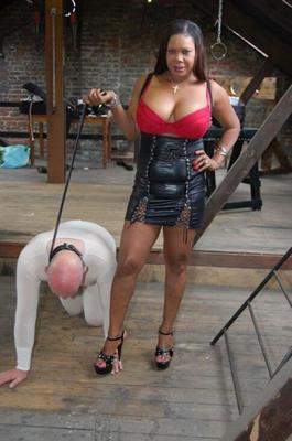 Ebony mistresses and their pet slaves