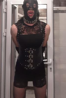 Fetish gimp slave in black leather and lace