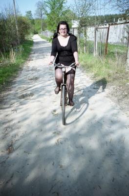 Curvy woman in bicycle