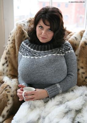 Big Boobed Brunette in Sweater on Fur Plaid