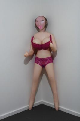 Big tit inflatable doll in purple lingerie.