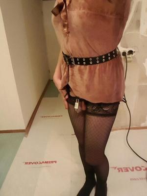 Fancy sissy in fishnets and chastity