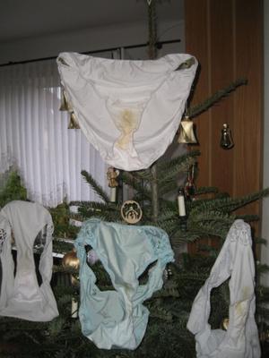 - dirty christmas with soiled panties on the christmas tree