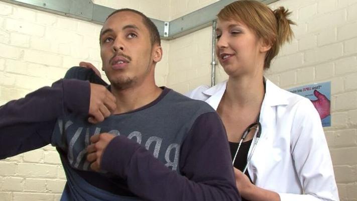 Female healthcare workers give body check to a asylum seeker for