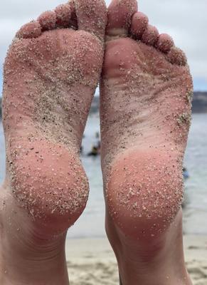 Ash’s sexy sand covered soles