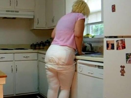 Mom shits diaper in kitchen