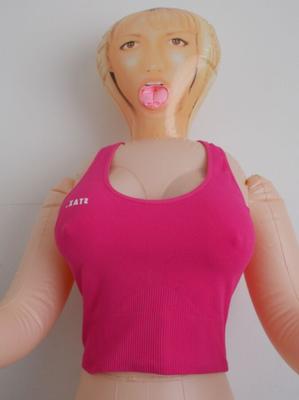 Compassionate Envi love doll wears a pink active wear bra