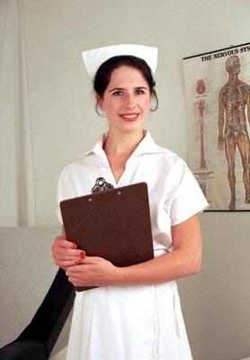 a Nurse examines a pregnant woman