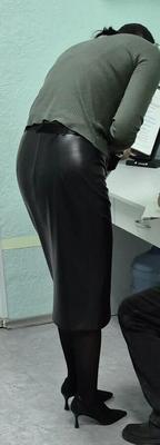 Co worker in leather skirt and suede heels